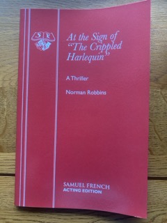 AT THE SIGN OF THE CRIPPLED HARLEQUIN by Norman Robbins